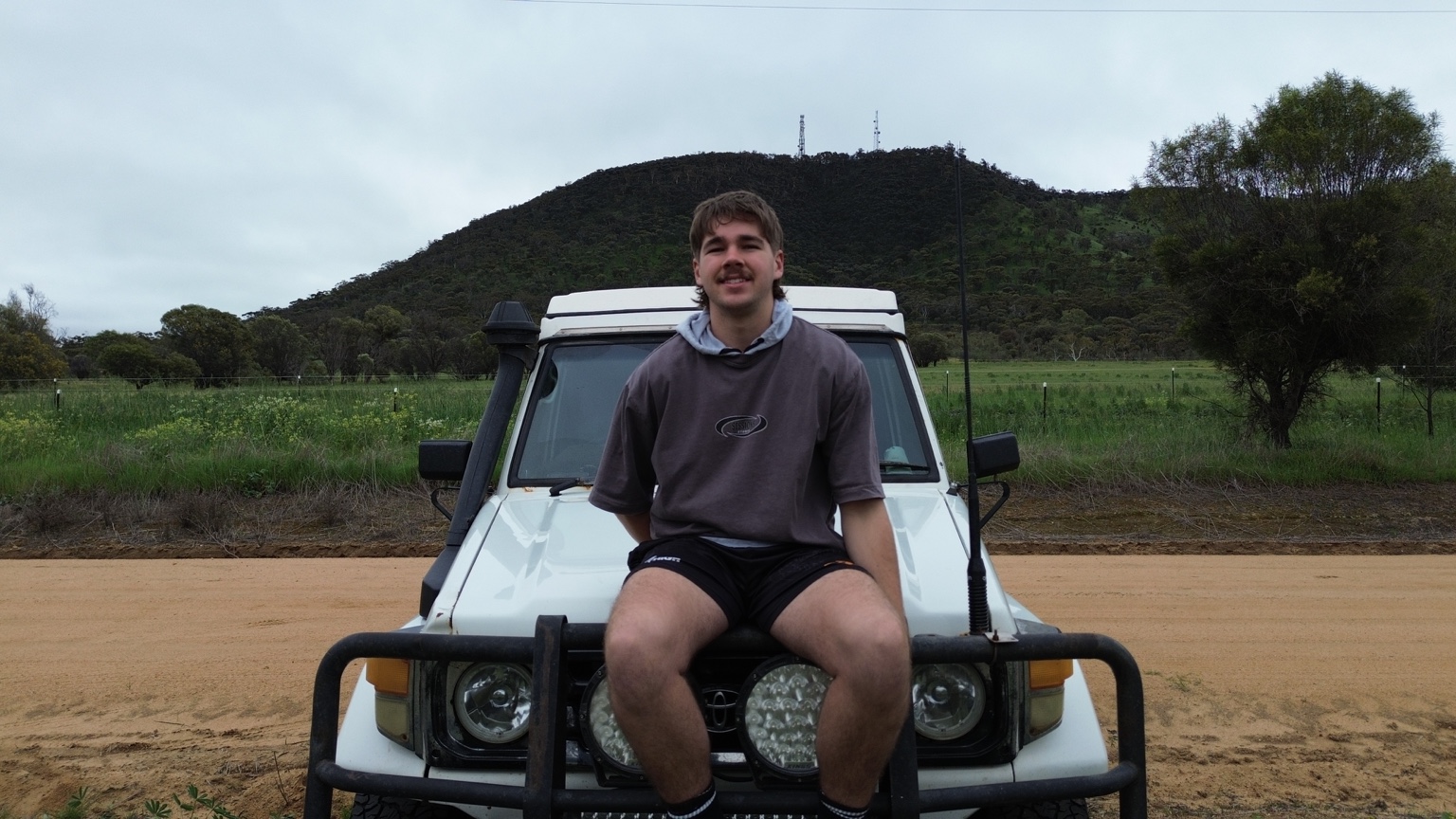 Jake Brennan in front of his four-wheel drive near Mount Bakewell